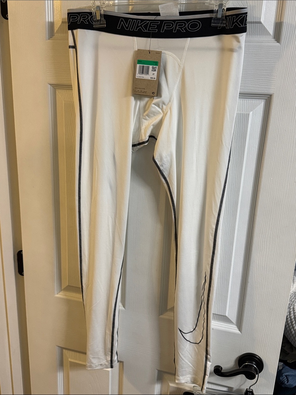 Nike White Compression Leggings with Black Waistband and Accent Stitching